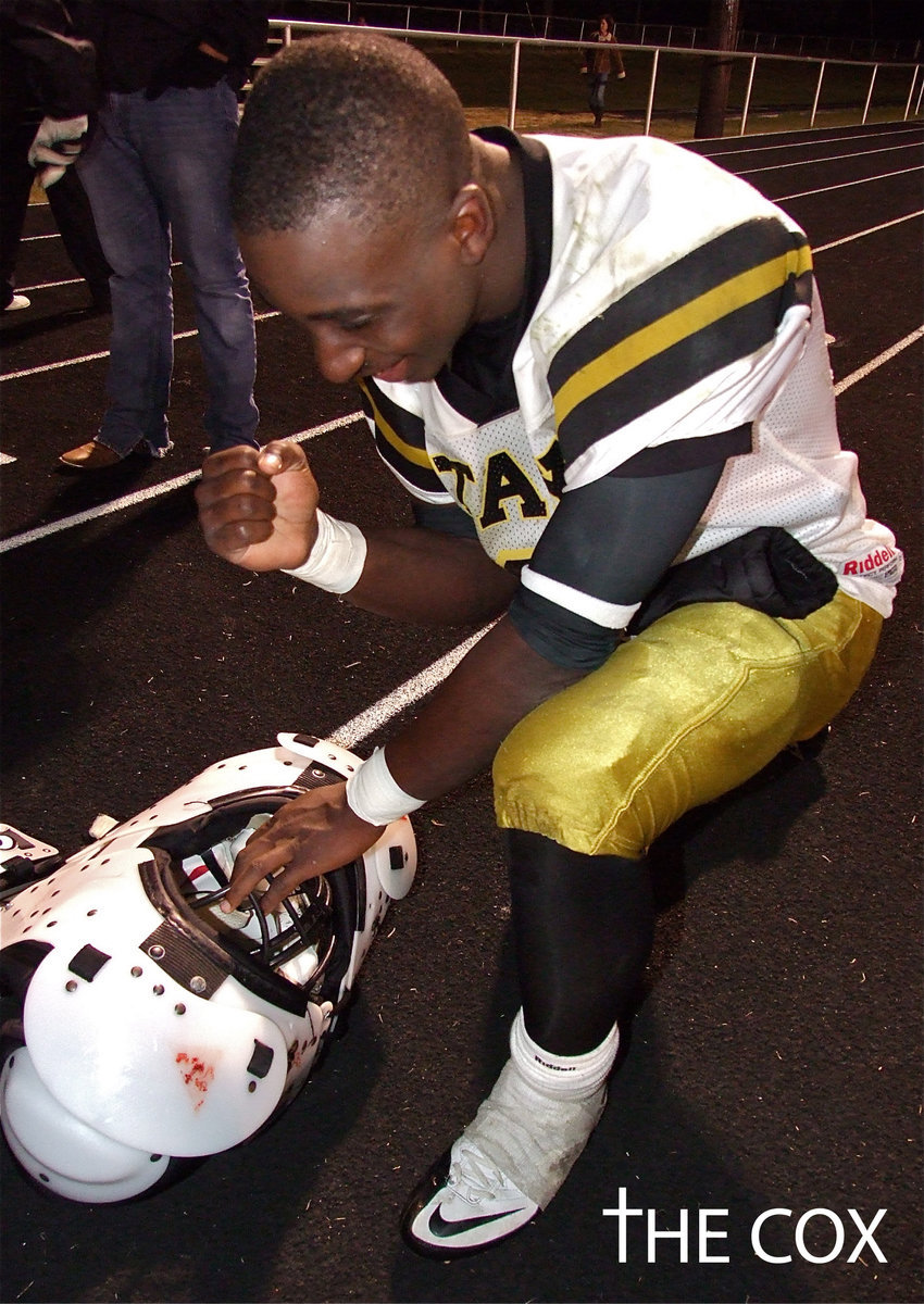 Image: Marvin Cox(3) gives his best Tim Tebow impersonation after defeating Cayuga.