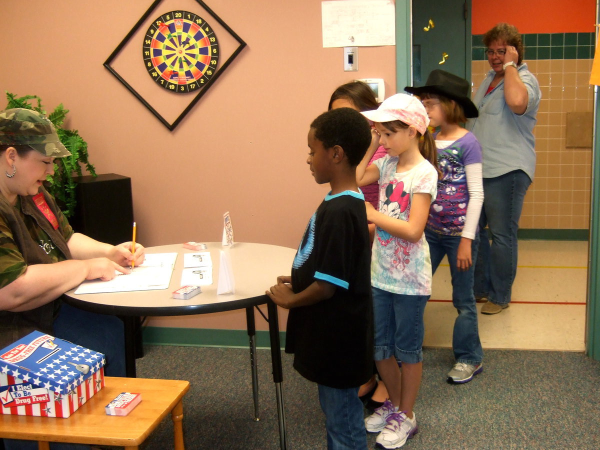 Image: Students being checked in to vote.