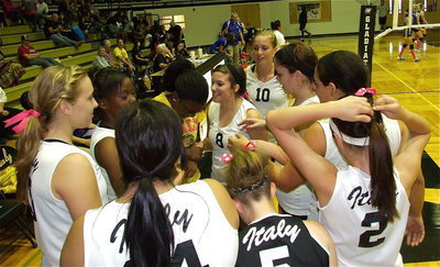 Image: Lady Gladiator head coach Jessika Robinson shares a light moment with her team during a timeout.