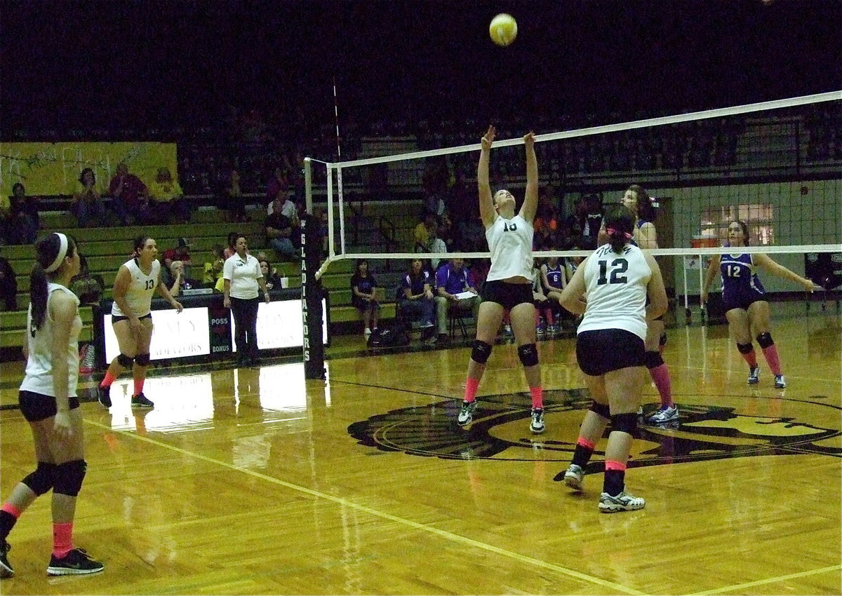 Image: Madison Washington(10) bumps the the ball to her teammates.