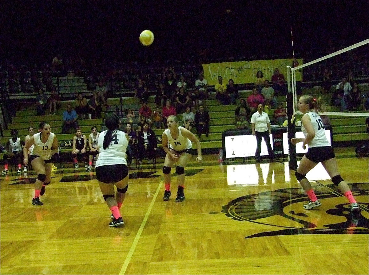 Image: Monserrat Figueroa(14) goes after the return as Alyssa Richards(13), Jaclynn Lewis(15) and Madison Washington(10) move into position.