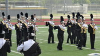 Image: The woodwinds march to the music.