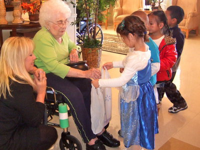 Image: Students getting candy from the residents.