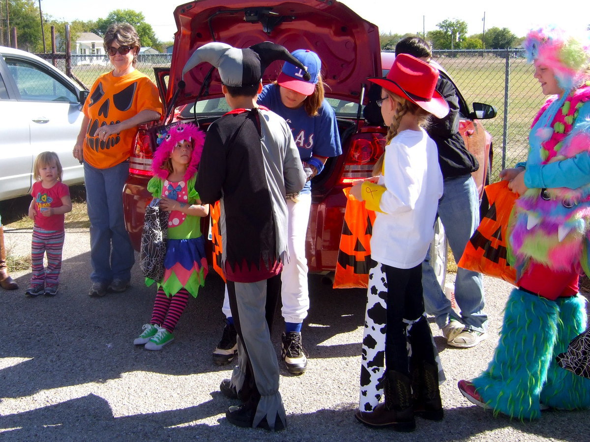 Image: Lots of parents supporting the kids and handing out candy.