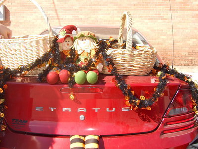 Image: Scarecrows and baskets of candy adorn this trunk.