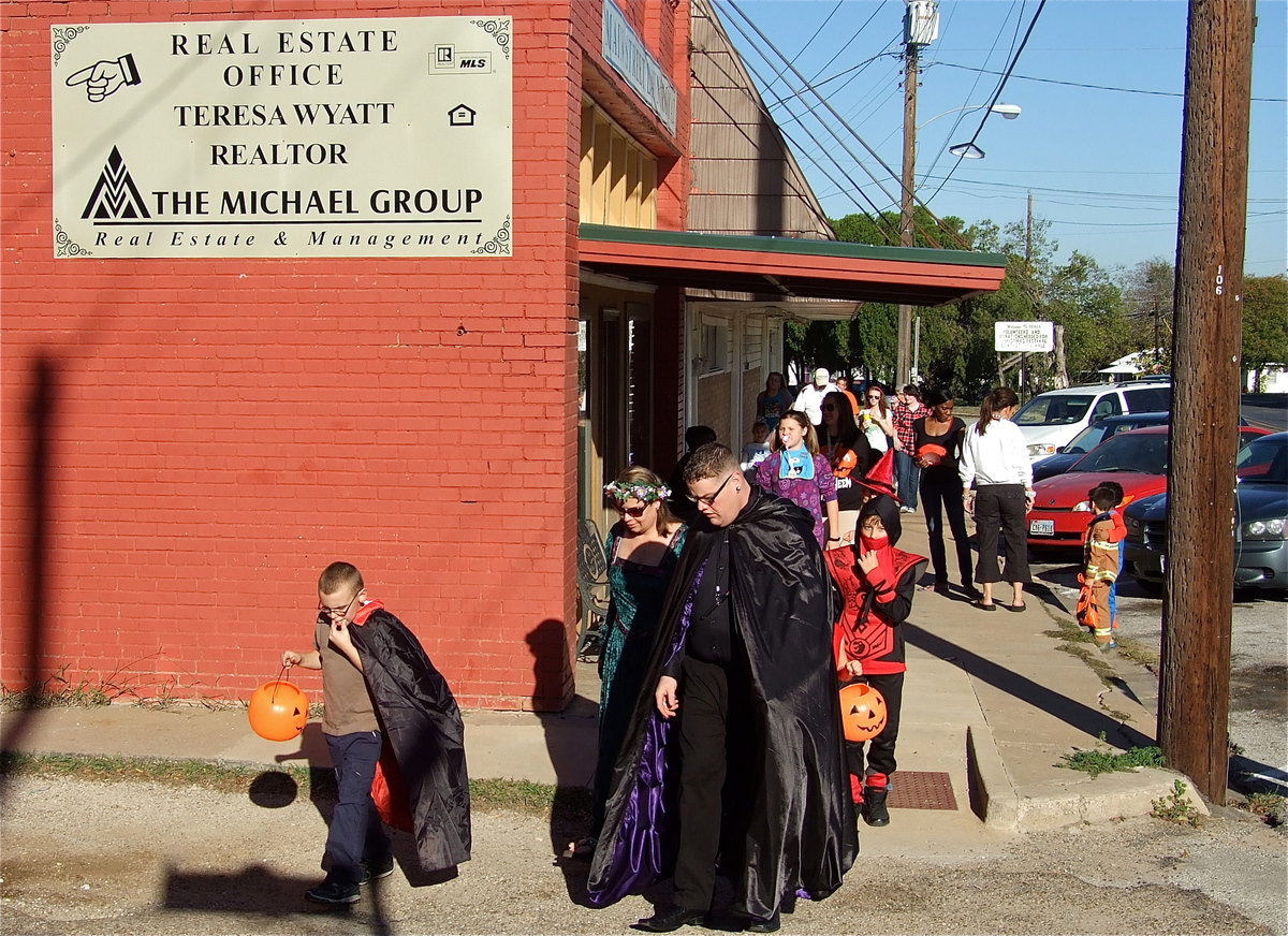 Image: Droves of trick-or-treaters made their way down both sides of main street in Italy collecting candy from participating local businesses.