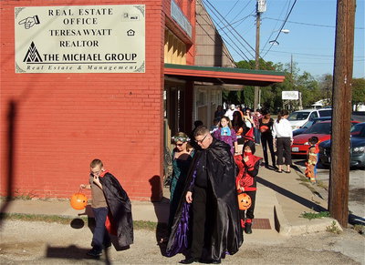 Image: Droves of trick-or-treaters made their way down both sides of main street in Italy collecting candy from participating local businesses.