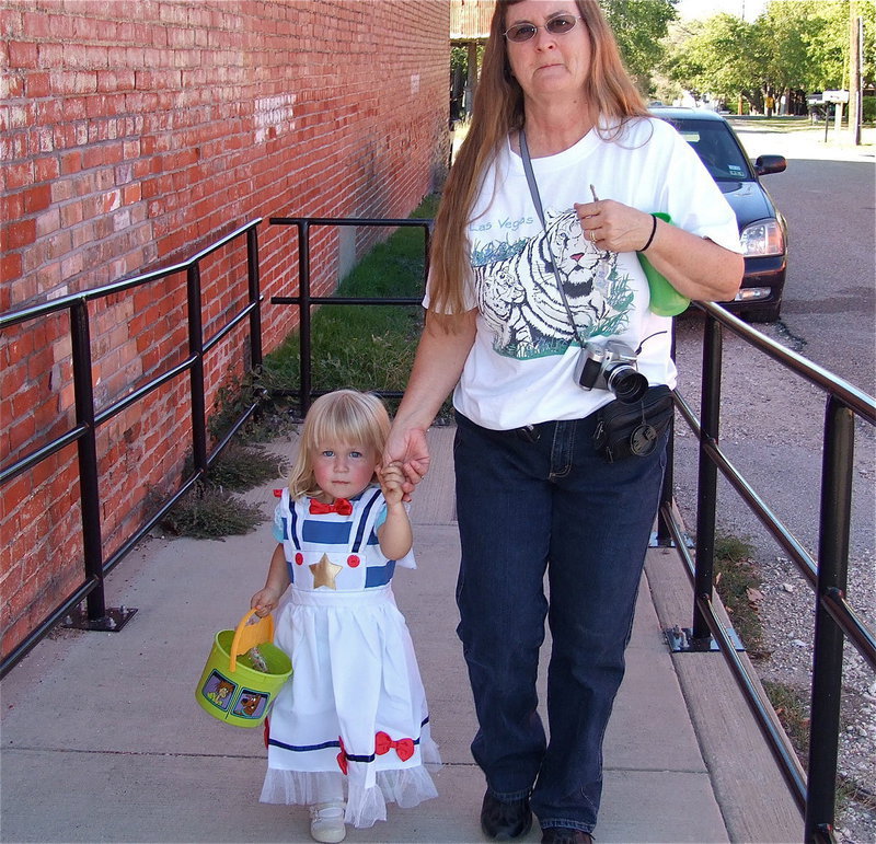 Image: Alicia Howard trick or treats with her grandma on main street in Italy.