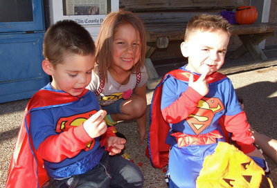 Image: Ella and the “super cousins” pick thru their Halloween haul.
