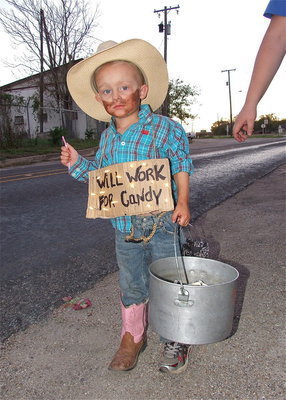 Image: Kase will work for candy as his marquee sign and bucket bag attracts donators.