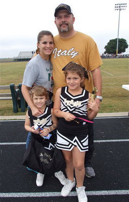 Image: C-team coach Mark Souder, Jr., his wife Melissa and their cheerleading daughters, Mayson and Taylor.
