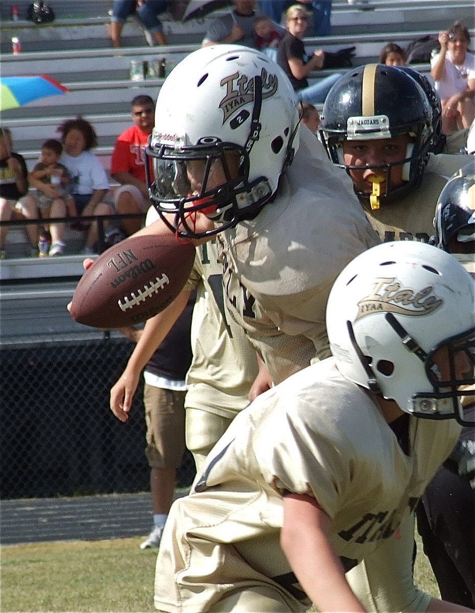 Image: Cade Brewer(21) leads the way for quarterback Ryder Itson(2) against Hubbard.