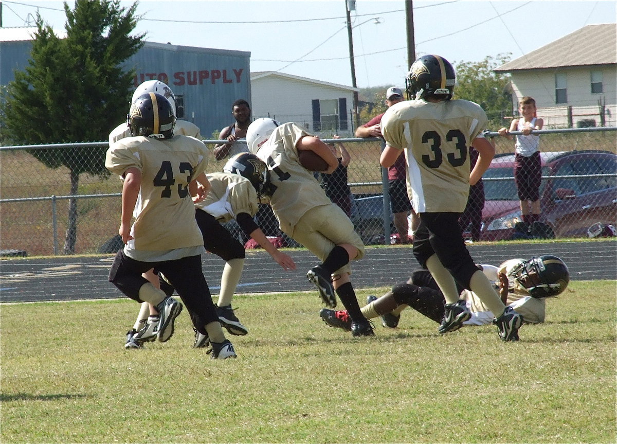 Image: Cade Brewer(21) is finally captured by the Jag’s defense after a long run to help seal the deal. The IYAA A-team wins the conference championship and advances to the NEH Superbowl being hosted in Italy.