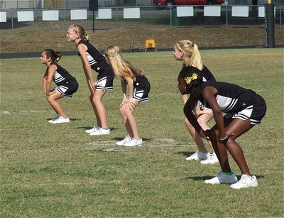 Image: The IYAA A-team cheerleaders compete in a cheer competition during halftime by performing a cheer and then doing a dance routine.