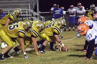 Image: Right tackle Zackery Boykin(55), guard Kevin Roldan(60) and center Kyle Fortenberry(66) make going 4-0 in district seem like a snap.