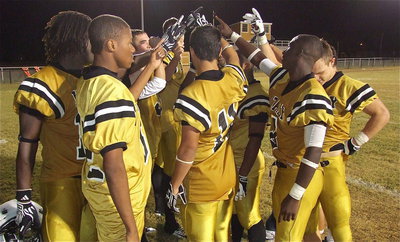 Image: Seniors have one last huddle after defending their home field against Gateway.