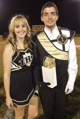 Image: Senior band member Zach Latimer is escorted by cheerleader Kelsey Nelson. Zach’s favorite band memory was the band’s Oklahoma camping trip.