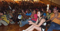 Image: The Seniors gather on the gym floor during the pep rally to watch a film about the seniors created by senior Meagan Hooker. Seniors rule!