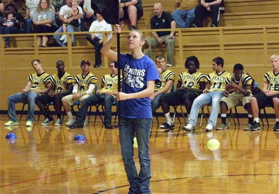 Image: Senior color guard member Brooke Miller execute her squad’s routine during the pep rally before Senior Night 2012.