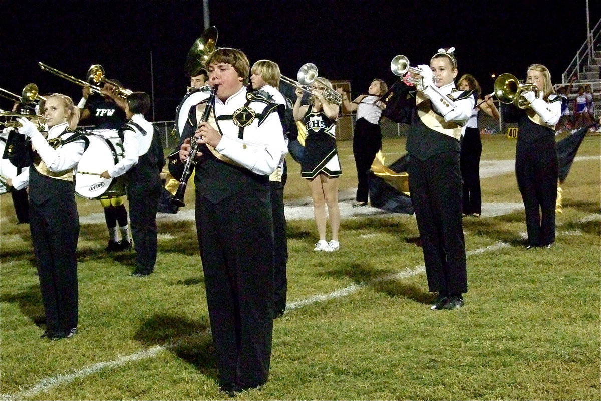 Image: Jennifer McDaniel, Alexis Minton, Trevor Patterson, Amber Hooker, Kelsey Nelson and Hannah Washington perform with the band during halftime.