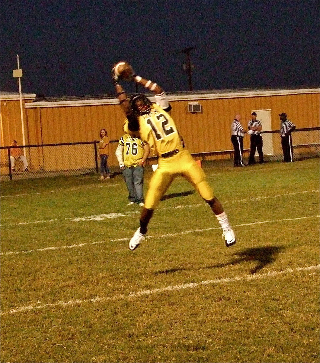 Image: Eric Carson(12) shows his ability while making this catch during warmups.