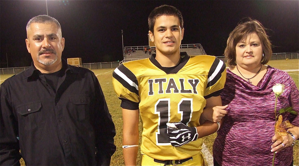 Image: Senior Gladiator Reid Jacinto(12) is escorted by his parents Mark and Susan Jacinto. Reid’s hobbies and interests include playing baseball, video games and hanging out with friends. His most memorable moment in athletics was bus rides to and from baseball games.