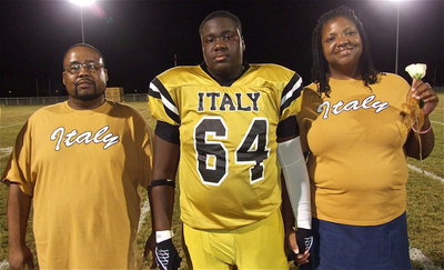 Image: Senior Gladiator Adrian Reed(64) is escorted by his parents Brendetta and Jimmy Reed. Adrian plans to attend Houston Baptist University and become an engineer. His most memorable moment in athletics was hanging out with friends before each game.