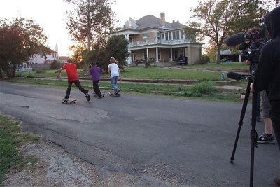 Image: Film crews catch the skateboarders in action.