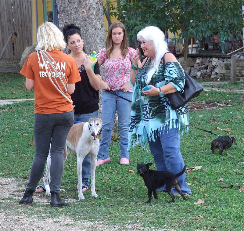 Image: Film makers keep their animal stars and owners on a schedule. On the right is Sugar Roberts with her star pet, Shorty.