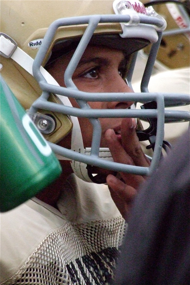 Image: Tylan Wallace(10) is intent on hearing the coaches advice.