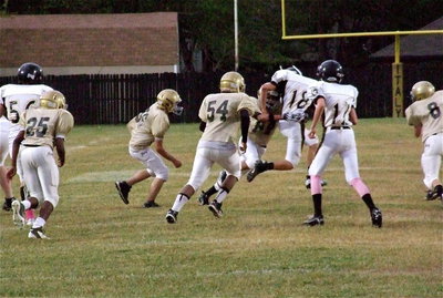Image: Cayuga runs the same play twice and Fabian Cortez(84) makes the read for the stop as Anthony Lusk(25), Elliott Worsham(56), Kenneth Norwood, Jr.(54) and Devon Bowles(8) gravitate toward the ball.