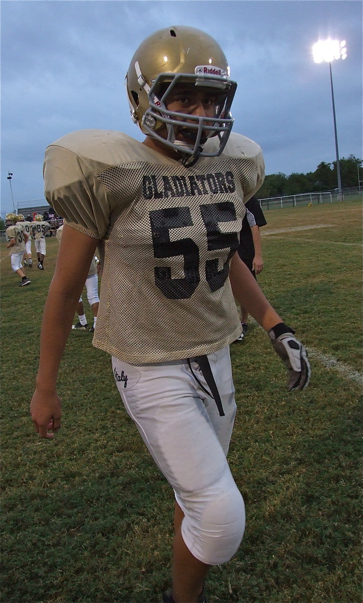 Image: Italy’s David De La Hoya(55) takes a break from the Cayuga game.