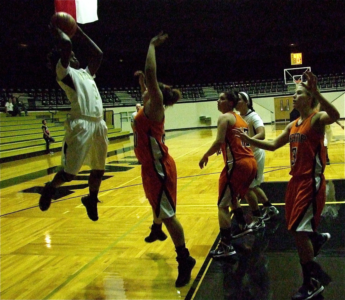 Image: Kortnei “KJ3” Johnson(3) rises for 2-points over a Kemp defender.