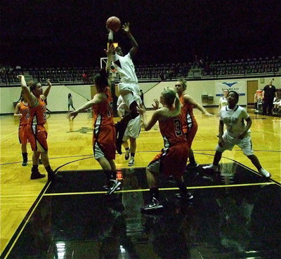 Image: Kortnei Johnson(3) glides down the middle of the lane for a bucket.
