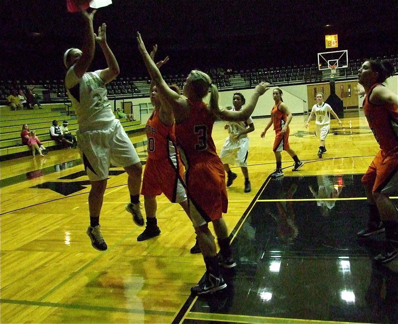 Image: Lady Gladiator Alyssa Richards(24) sinks a baseline jumper over Kemp defenders.