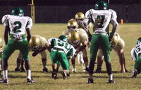 Image: Flanked by his guards, Kenneth Norwood, Jr.,(54) Austin Pittman(51), and center David De La Hoya(55) prepares to snap the ball to quarterback Tylan Wallace(10) with tailback Joe Celis(24) hungry for the end zone. Italy ended their final game of the 2012 season with a 38-30 win over the Bobcats.