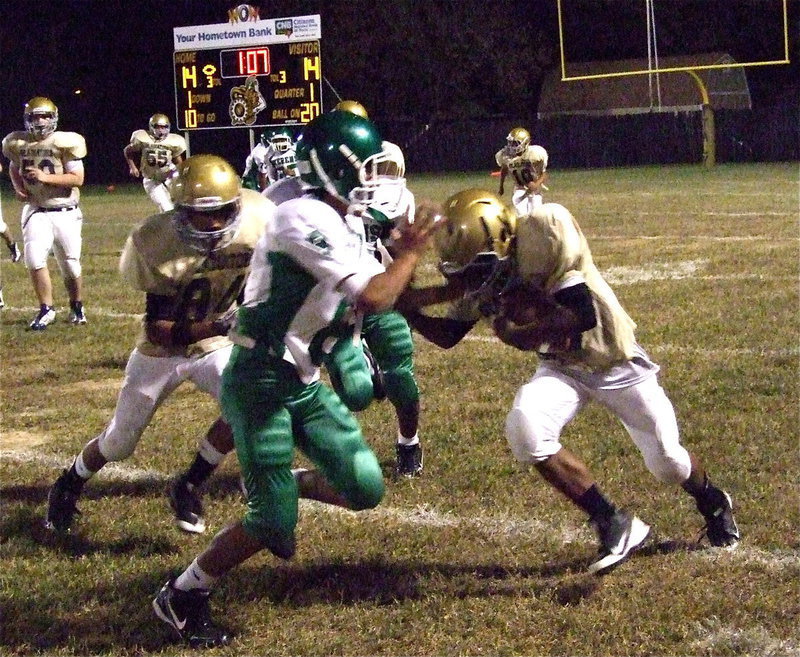 Image: Kendrick Norwood(20) lowers the boom on a Keren’s tackler with Fabian Cortez(84) blocking downfield.