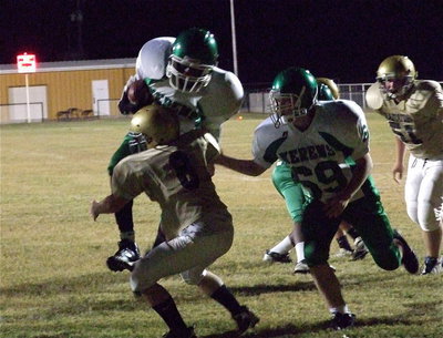 Image: Italy JH linebacker Devin Bowles(8) meets a Kerens’ Bobcat in the hole at the goal line.