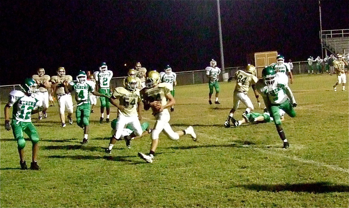 Image: Joe Celis(24) scores a 2-point conversion behind the blocking of Fabian Cortez(84) and Kenneth Norwood(54).