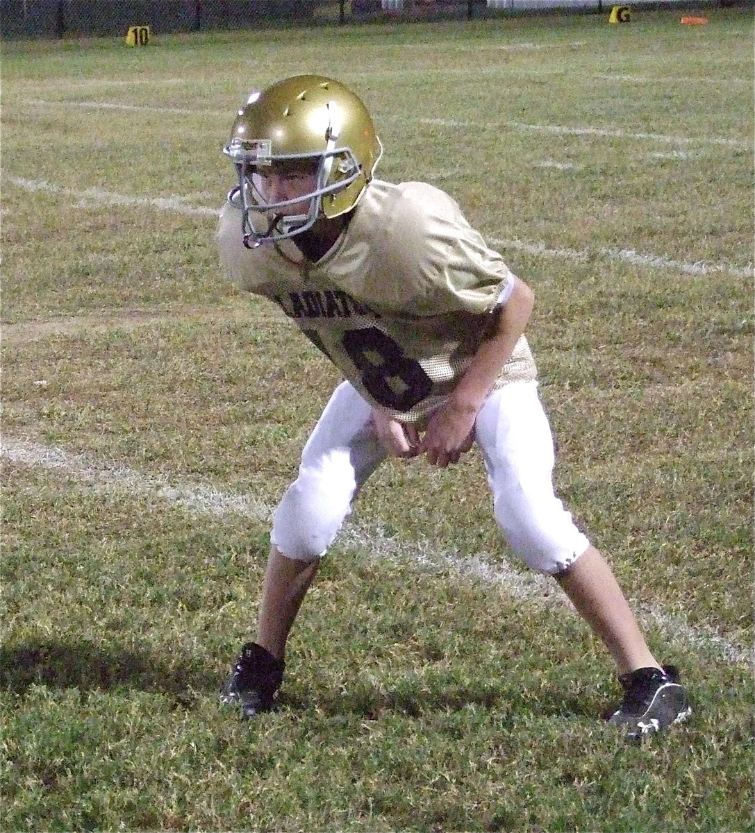 Image: In the third-quarter against Kerens, Garrett Janek(18) has a determined look while at cornerback.