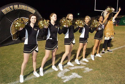 Image: The IHS cheerleaders are joined by mascot Reagan Adams for the playing of the school song.