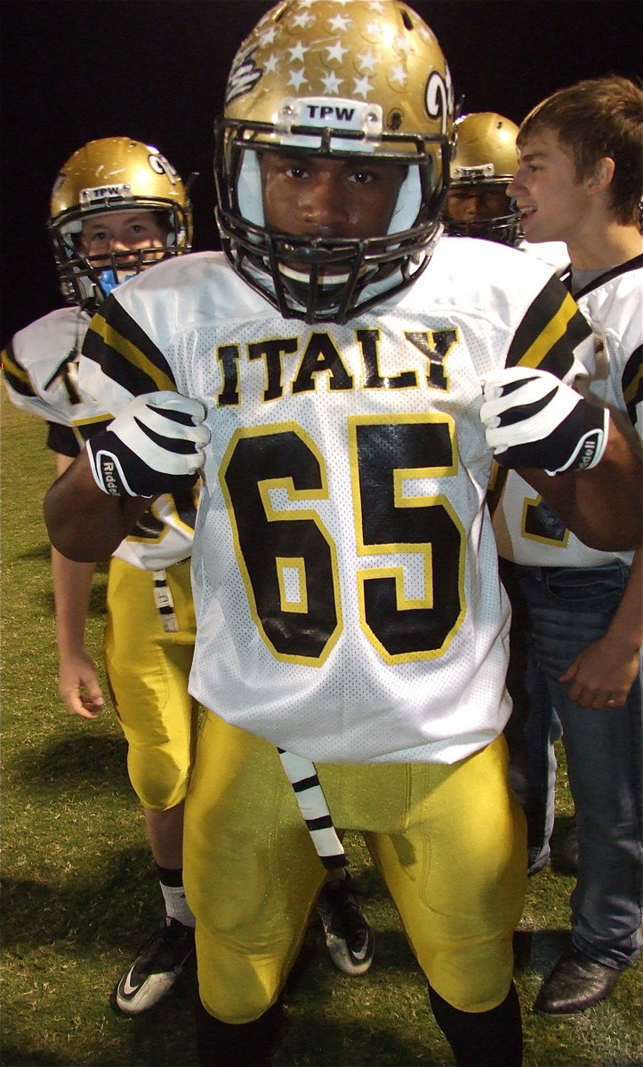 Image: Gladiators John Escamilla(56), Jalarnce Jamal Lewis(65), John Hughes(62) and Brandon Connor(77) celebrate Italy’s district championship accomplishment.