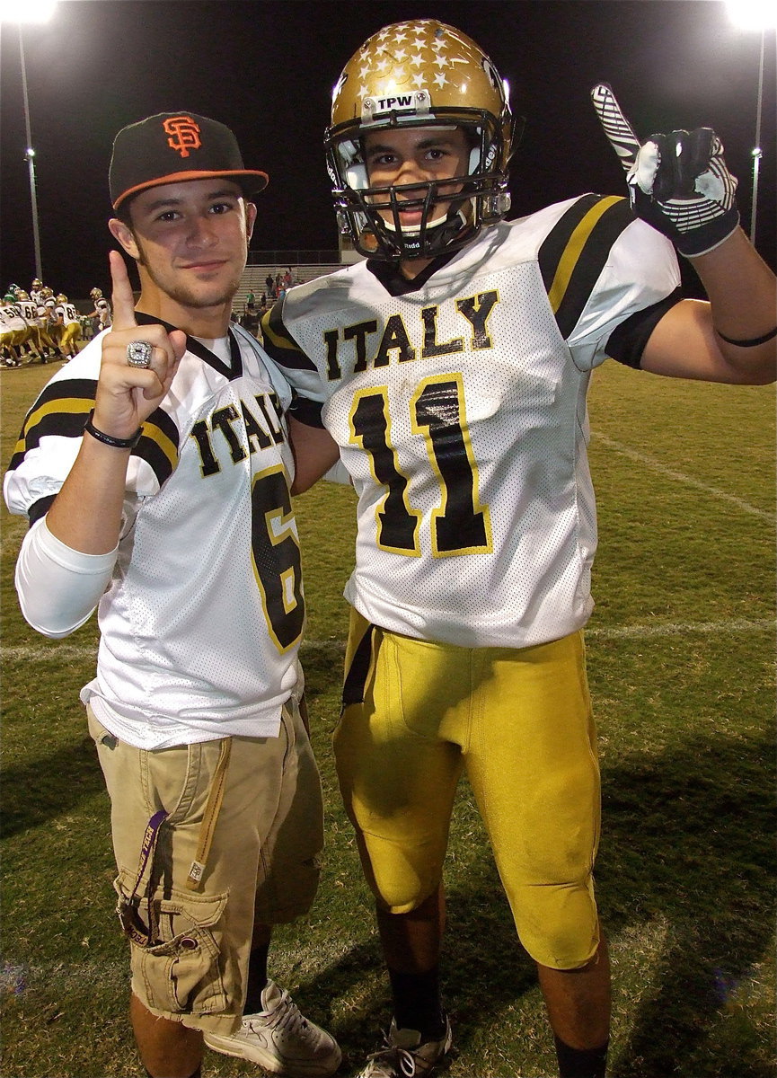 Image: Cousins Caden Jacinto(6) and Reid Jacinto(11) celebrate Italy’s district championship as the offense takes a victory snap.