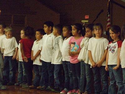 Image: Stafford’s kindergarten and first graders gathered to sing “Grand Old Flag”.