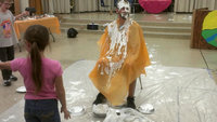 Image: Coach Nate Skelton sat still as the pie-in-the-face contest took a messy turn.