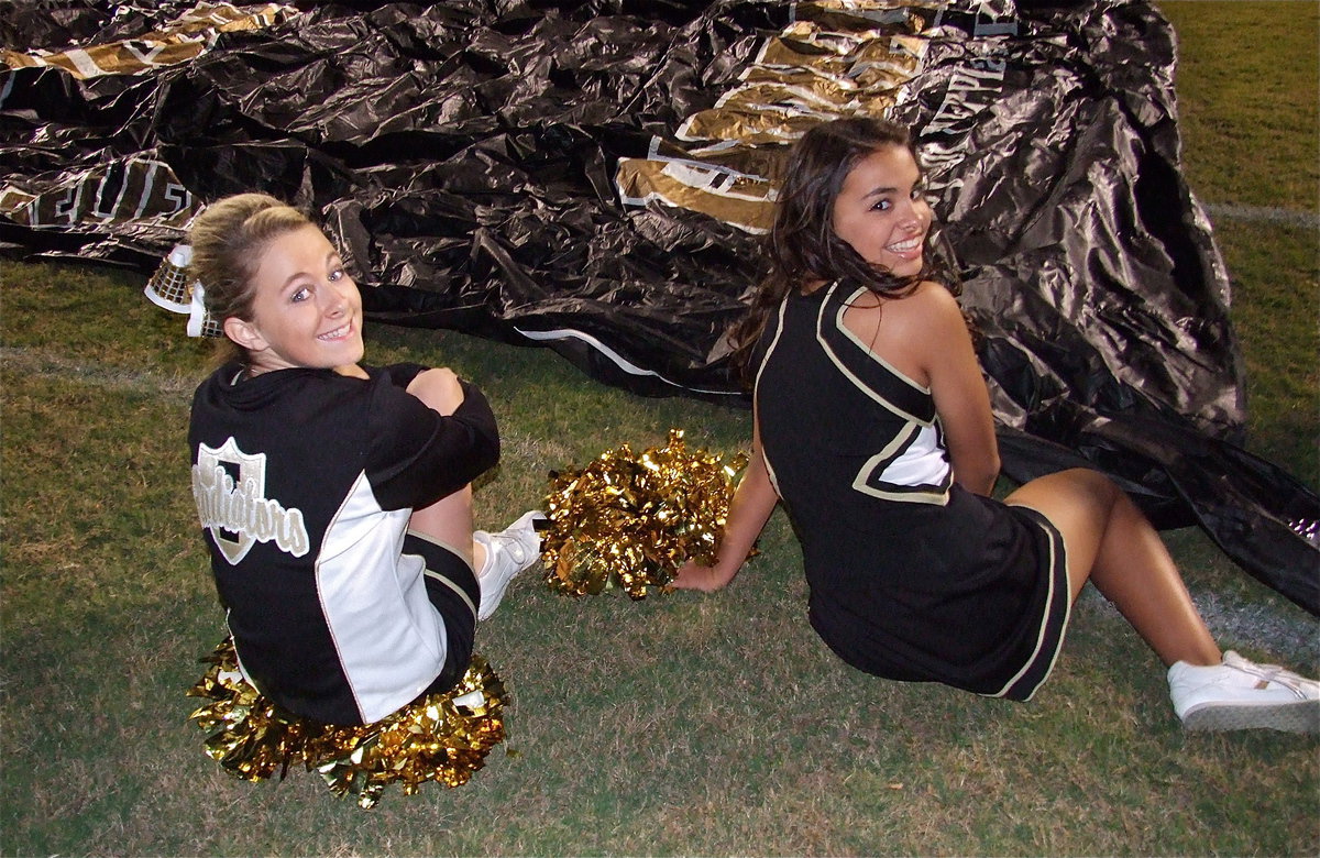 Image: Here’s looking at ya, Gladiators! IHS cheerleaders Britney Chambers and Ashlyn Jacinto await the start of the battle between Italy and Kerens.