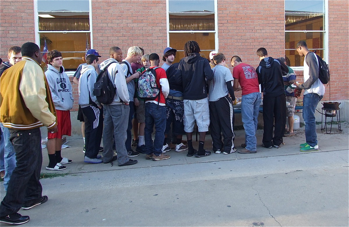 Image: All in: The Gladiators line up for the cookout kickoff.