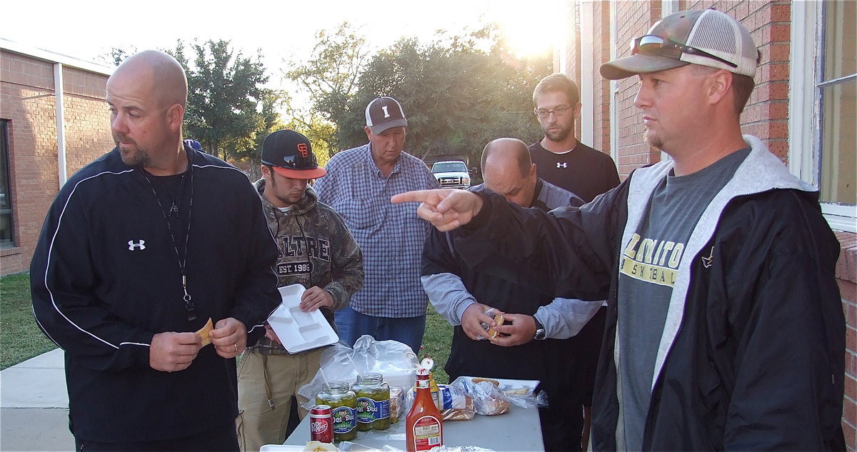 Image: Coaches Josh Ward and Hank Hollywood plan the group’s next move.