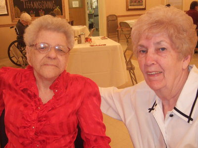 Image: Wilma Hanks shares her Thanksgiving meal with her sister-in-law Birdie Bell.