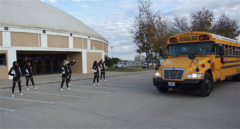 Image: The Italy High School cheerleaders pump up the crowd as the team bus passes thru the school parking lot with fans giving the Gladiators a “good luck” sendoff while on their way to Pennington Field in Bedford to take on Valley View for the area championship.